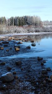 Preview wallpaper lake, water, stones, snow, trees, winter, forest, nature