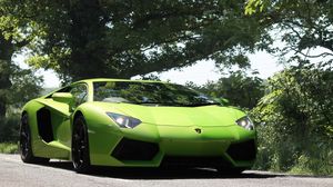 Preview wallpaper lamborghini, aventador, front view, green, lights, trees, sky