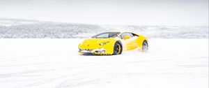 Preview wallpaper lamborghini aventador, lamborghini, yellow, winter, snow, sportscar, supercar