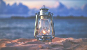 Preview wallpaper lamp, lantern, fire, sand, beach