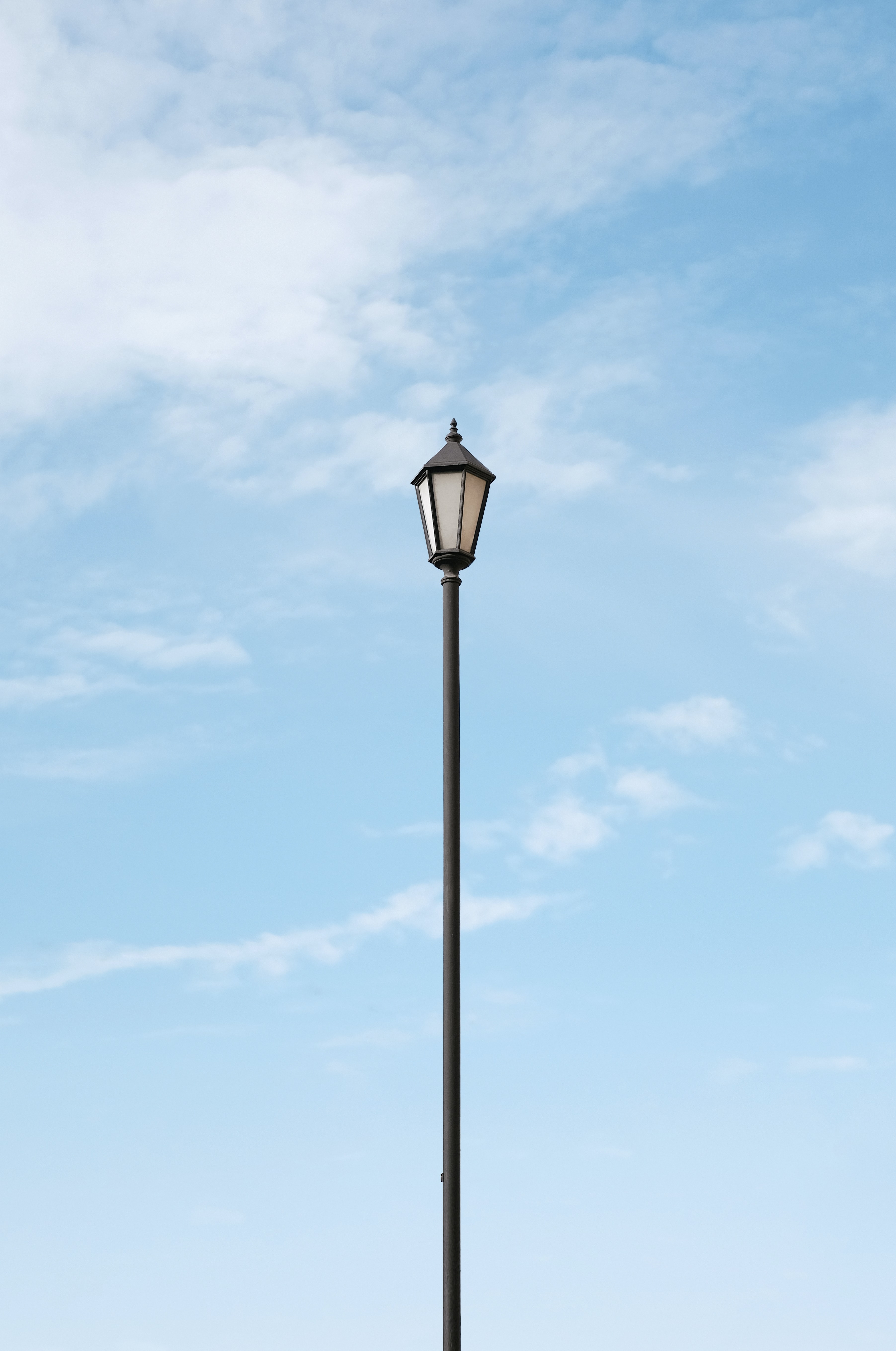 Download wallpaper 3606x5436 lamppost, pole, clouds, sky, minimalism hd