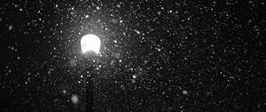 Preview wallpaper lamppost, snow, light, glare, night, bw