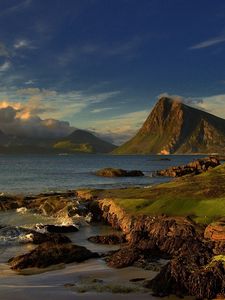 Preview wallpaper land, coast, sea, mountain, slopes, wave, sky, clouds, earth