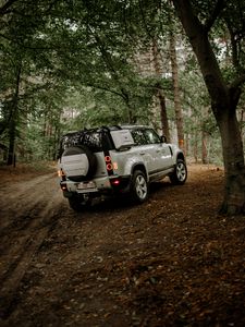 Preview wallpaper land rover, car, suv, rear view, forest