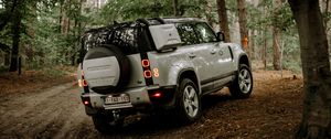 Preview wallpaper land rover, car, suv, rear view, forest