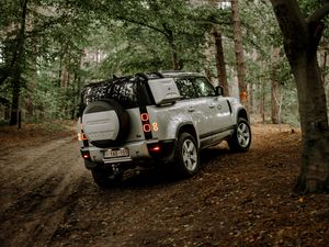 Preview wallpaper land rover, car, suv, rear view, forest