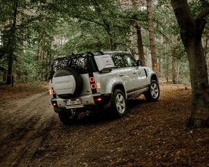 Preview wallpaper land rover, car, suv, rear view, forest