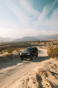 Preview wallpaper land rover, car, suv, black, sand