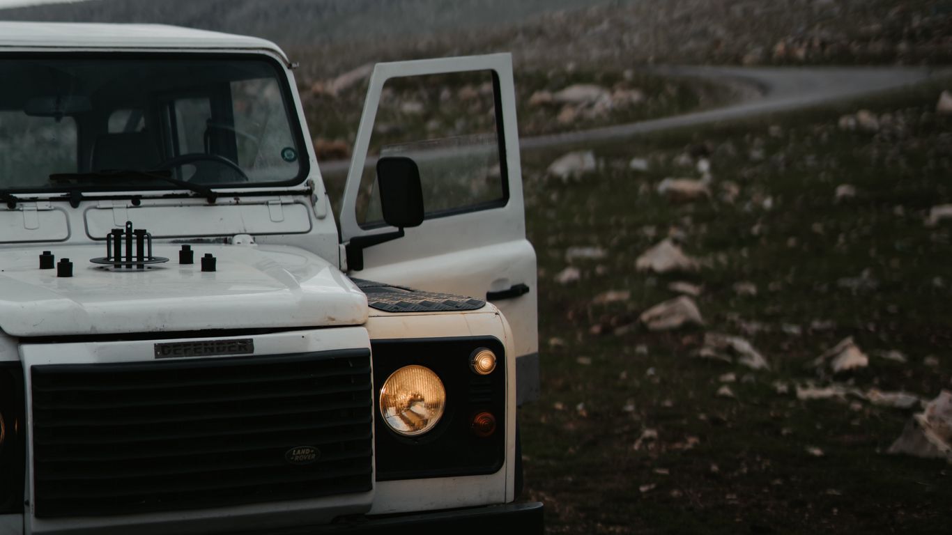 Download wallpaper 1366x768 land rover defender, land rover, car, white,  suv, road tablet, laptop hd background