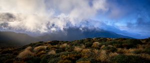 Preview wallpaper landscape, clouds, mountains, hills, bushes