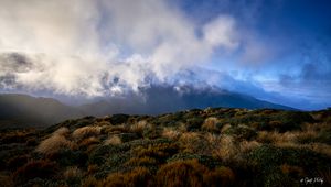 Preview wallpaper landscape, clouds, mountains, hills, bushes