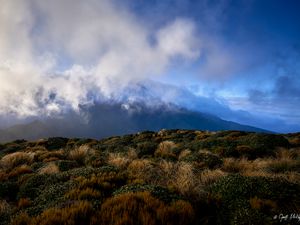 Preview wallpaper landscape, clouds, mountains, hills, bushes