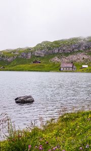 Preview wallpaper landscape, lake, houses, stone, shore, grass