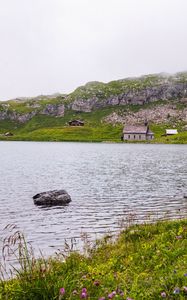 Preview wallpaper landscape, lake, houses, stone, shore, grass