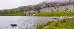 Preview wallpaper landscape, lake, houses, stone, shore, grass