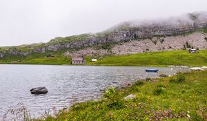 Preview wallpaper landscape, lake, houses, stone, shore, grass
