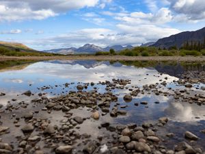 Preview wallpaper landscape, lake, stones, mountains, reflection