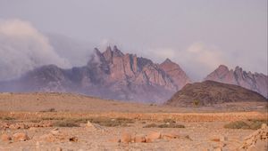 Preview wallpaper landscape, mountains, desert, rocks, fog, stones, nature
