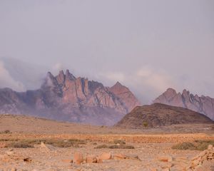 Preview wallpaper landscape, mountains, desert, rocks, fog, stones, nature