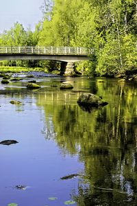 Preview wallpaper landscape, river, bridge, stones, trees, reflection, nature