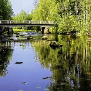 Preview wallpaper landscape, river, bridge, stones, trees, reflection, nature