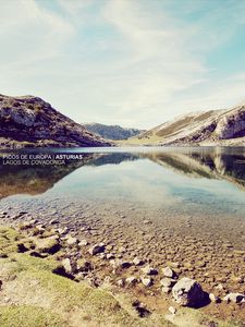 Preview wallpaper landscape, stones, coast, lake, mountains, colors, faded, inscription