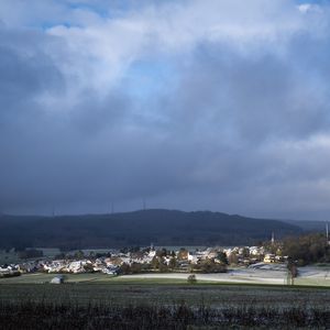 Preview wallpaper landscape, village, field, sky, clouds, nature