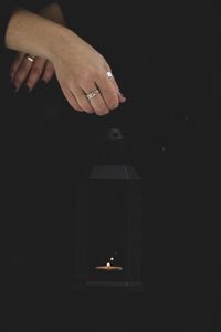 Preview wallpaper lantern, candle, fire, hand, black