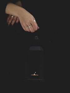 Preview wallpaper lantern, candle, fire, hand, black