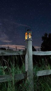 Preview wallpaper lantern, fence, starry sky, sky, night, grass