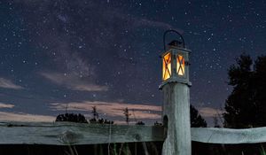 Preview wallpaper lantern, fence, starry sky, sky, night, grass