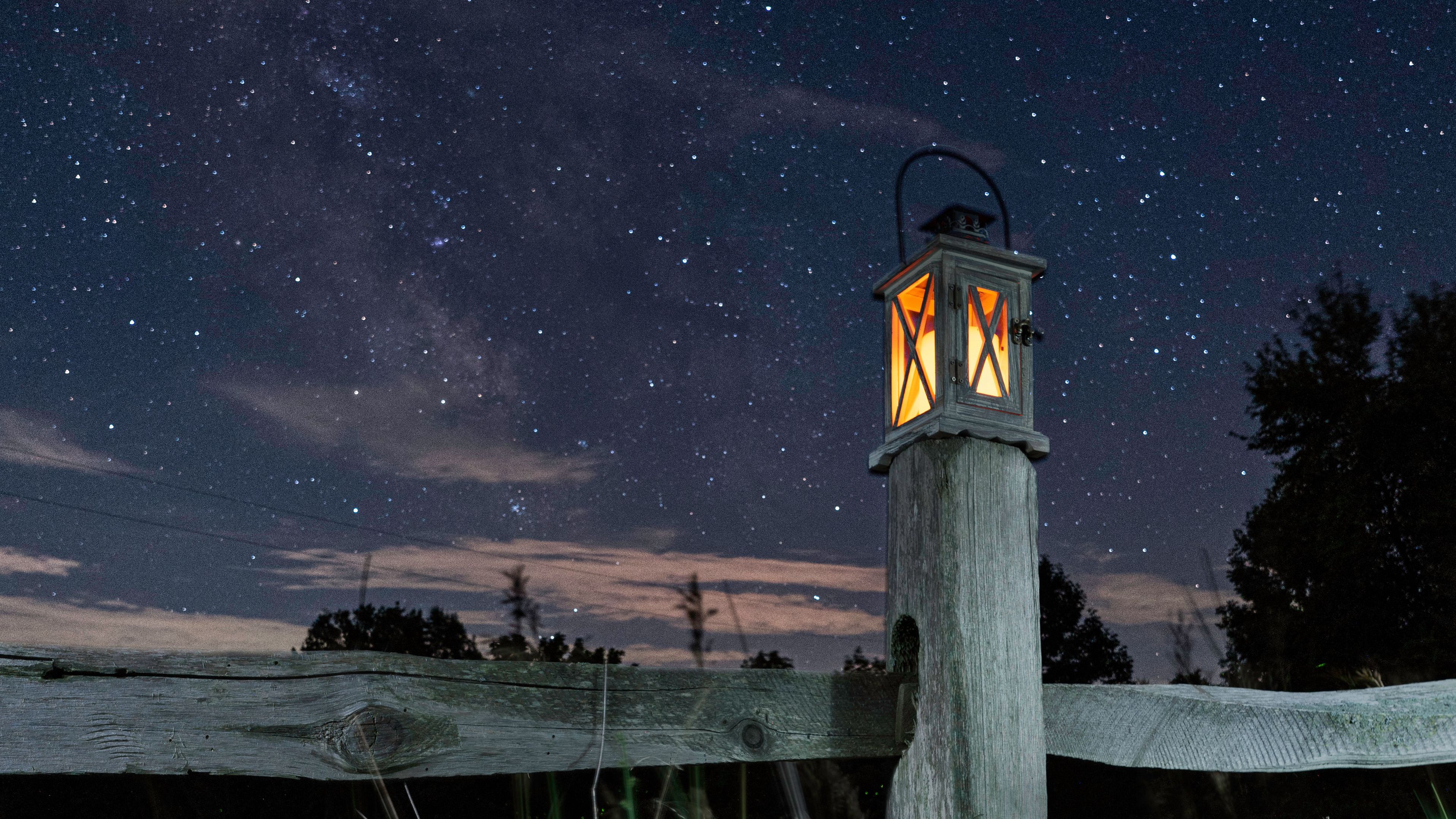 Download wallpaper 3840x2160 lantern, fence, starry sky, sky, night