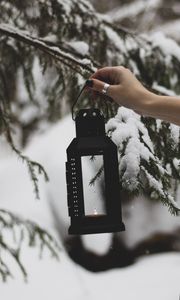 Preview wallpaper lantern, fire, hand, branch, tree, snow