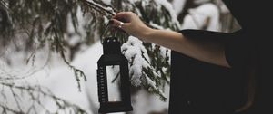 Preview wallpaper lantern, fire, hand, branch, tree, snow