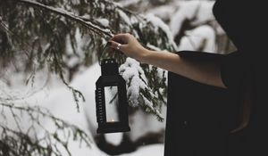 Preview wallpaper lantern, fire, hand, branch, tree, snow