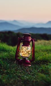 Preview wallpaper lantern, garland, grass, distance