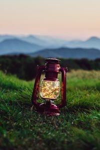 Preview wallpaper lantern, garland, grass, distance