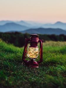 Preview wallpaper lantern, garland, grass, distance