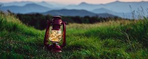 Preview wallpaper lantern, garland, grass, distance