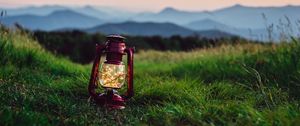 Preview wallpaper lantern, garland, grass, distance