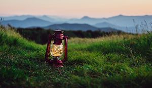 Preview wallpaper lantern, garland, grass, distance