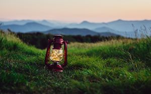 Preview wallpaper lantern, garland, grass, distance