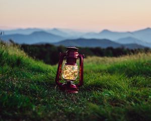 Preview wallpaper lantern, garland, grass, distance