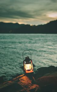 Preview wallpaper lantern, garland, light, stones, shore