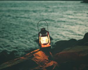 Preview wallpaper lantern, garland, light, stones, shore