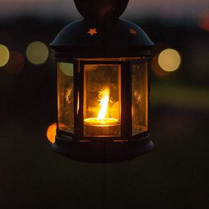 Preview wallpaper lantern, glow, hand, dark