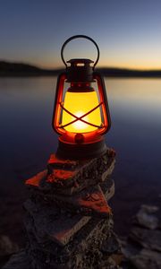 Preview wallpaper lantern, light, stones, lake, shore