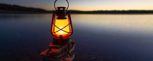 Preview wallpaper lantern, light, stones, lake, shore