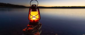 Preview wallpaper lantern, light, stones, lake, shore