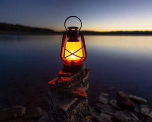 Preview wallpaper lantern, light, stones, lake, shore